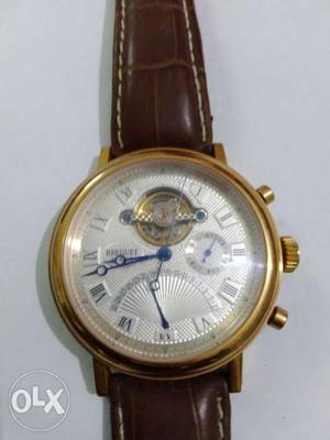 Round Gold-colored Chronograph Watch With Brown Leather