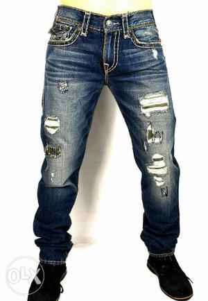 TR Jeans with white thread and round pockets.