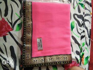 Folded Pink And Brown Textile