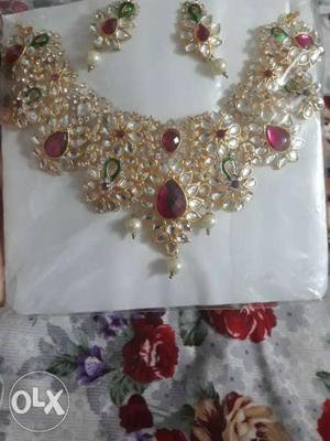 Gold-colored Bib Necklace With Pink Encrusted Gemstone
