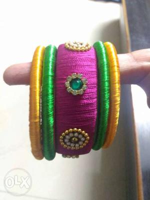 Green, Purple, And Pink Beaded Bangles