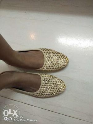Pair Of Beige Flat Shoes