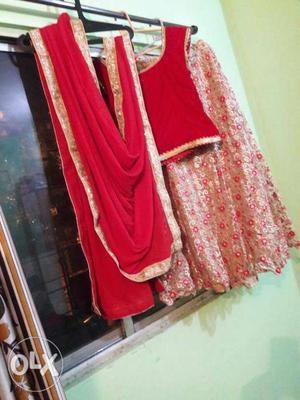 Red and golden lehanga choli 2 time use only Mira