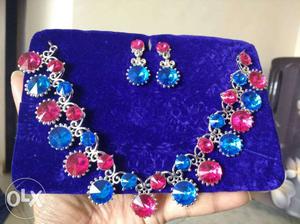 Silver-colored Necklace With Blue And Red Gemstones