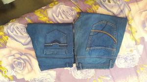 Two Blue And Black Denim Bottoms