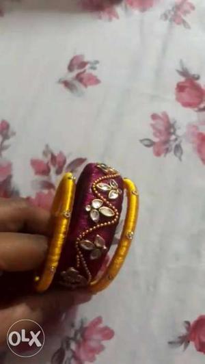 Two Yellow And One Red Silk Thread Bangles