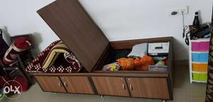 2.5 × 6 ft wooden storage bed with mattress