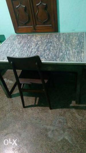 A dining table for sale with 4 chairs.