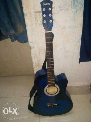 Acoustic Guitar with guitar capo,extra string,plectrums