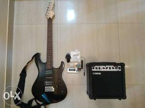 Black Electric Guitar And Amplifier