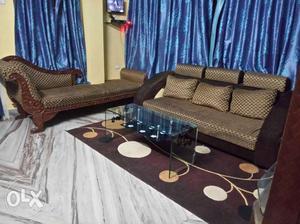 Brown and black sofa made of cloth material. The