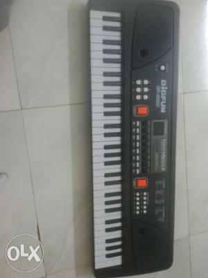 Electronic piano with 63 keys and having 16