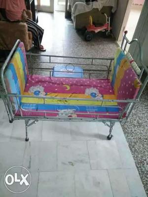 Toddler's Gray Metal Bed Frame And Pink And Multicolored