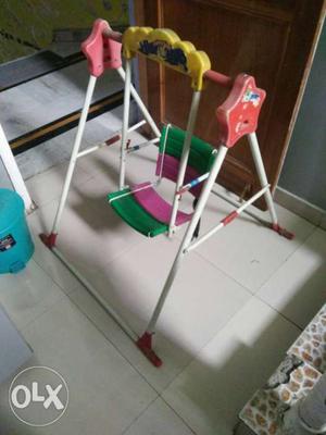 Toddler's White, Green, And Purple Swing Chair