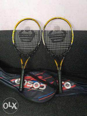 Two Black And Yellow Cosco Tennis Rackets