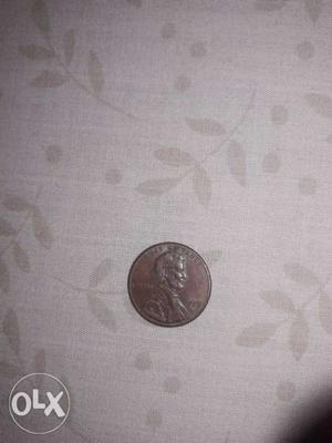 Round Silver-colored Lincoln Cent Coin