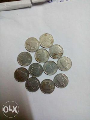Rounded silver colored coins