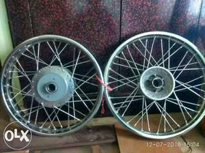 Two White And Blue Bicycle Wheels