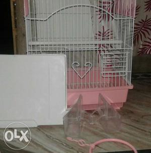 Bird cage colour:-pink and white and price can