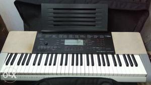Black And Beige Electronic Keyboard