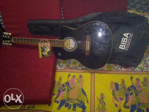 Black And Brown Acoustic Guitar With Bag