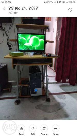 Computer along with table..
