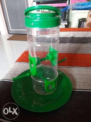 Green And Clear Plastic Bird Feeder