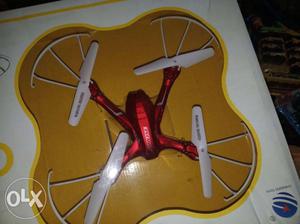 Red And White Drone With Box