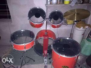 Red, Black, And Gray Drum Kit