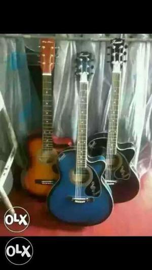 Three Brown, Black, And Blue Single-cutaway Acoustic Guitars