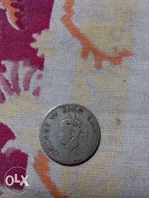 's coin. George VI king emperor. Quarter