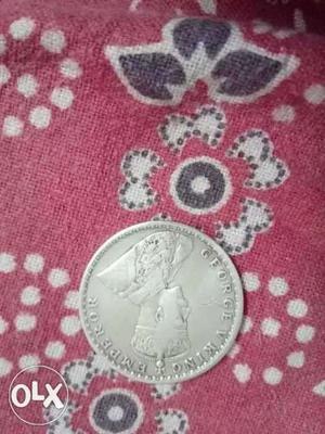 102 year old one rupee. silver coin.