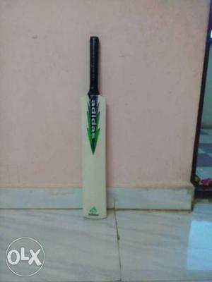 Beige, Green, And Black Adidas Cricket Bat