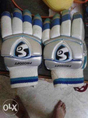 Pair Of White-and-blue SG Gloves