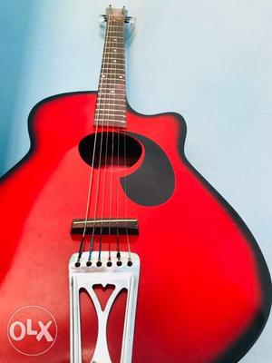 Red Wooden Acoustic Guitar