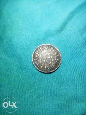  Silver-colored One Quarter Anna India Coin
