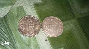 Two Round Silver-colored Indian Anna Coins