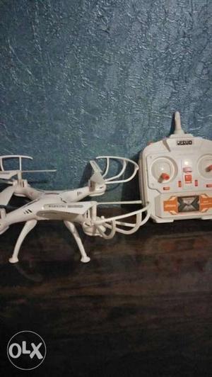 White Quadcopter Drone With Radio Controller