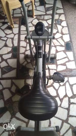 Black And Gray Stationary Bike with roller coaster.
