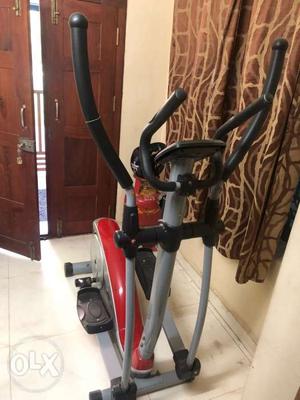 Black, Gray, And Red Elliptical Trainer