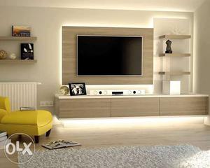 Gray Flat Screen Television And White Wooden TV Stand