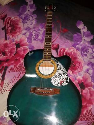 Green And Brown Acoustic Guitar