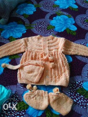 Handmade woollen baby sweaters