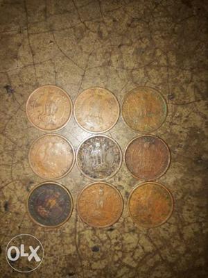 Nine Round Copper-colored Coins