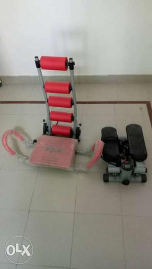 Red And Gray Exercise Equipment And Black Mini Stepper