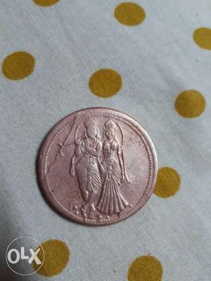 Round Copper Coin With Two People Emboss