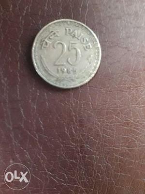 Round Silver-colored 25 Indian Paisa Coin