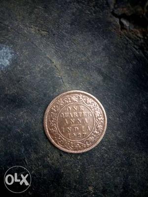 Round copper 1 quater anna coin 