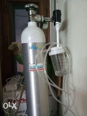 Silver And White Oxygen Tank