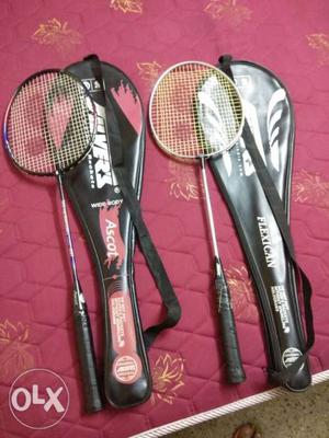 Two Gray-and-black Badminton Rackets